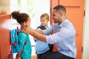 Backpack kids with father