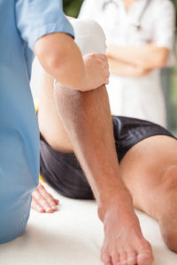 client receiving personal training and hands on care for their injury
