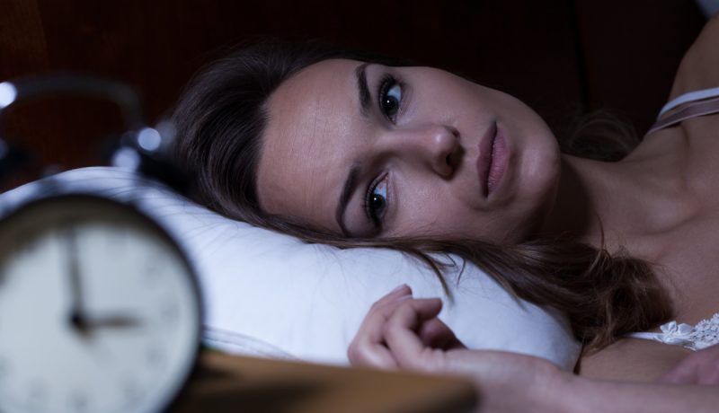 Insomniac woman awake at night