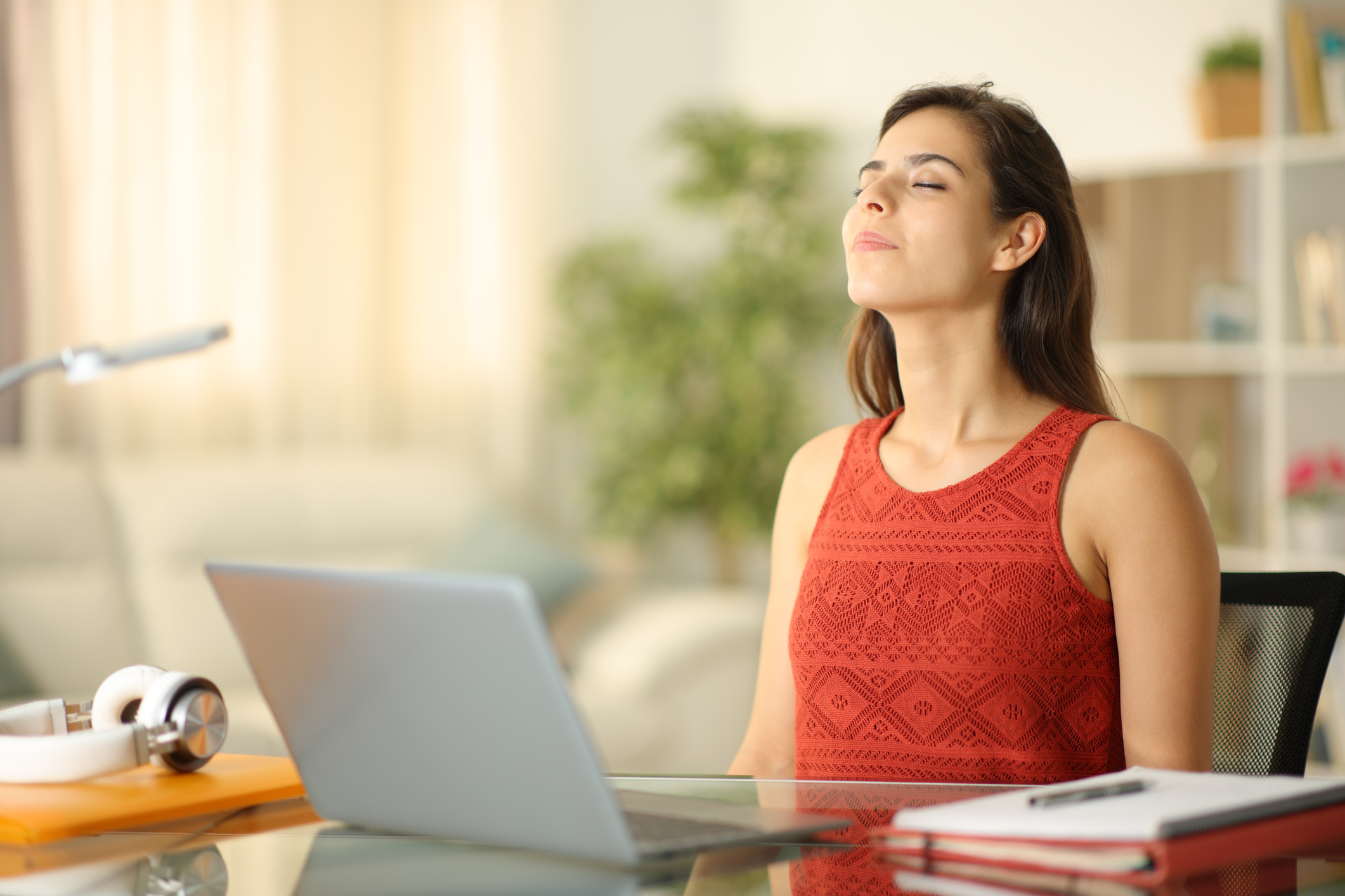 Female performing focued box breathing in office to improve focus